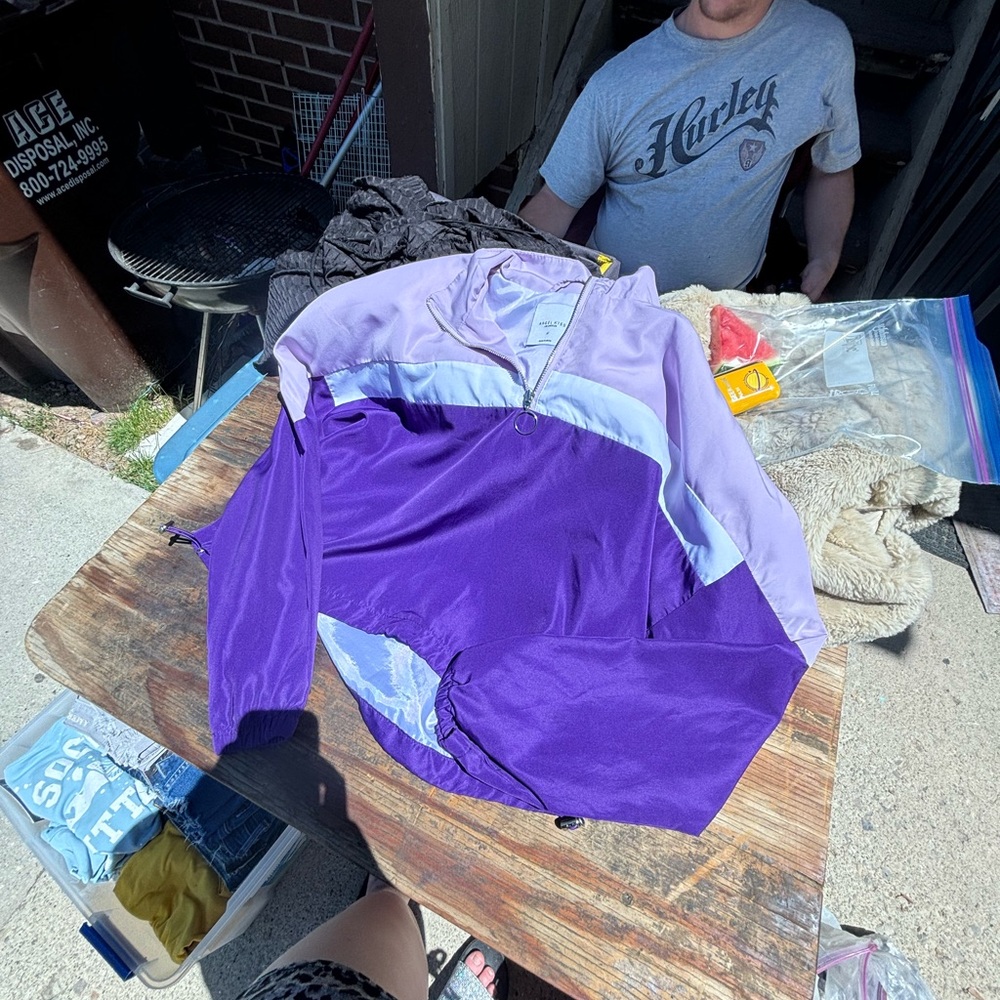 Light purple, dark purple, white windbreaker